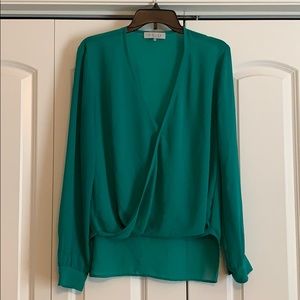Greenish-turquoise long sleeve blouse.